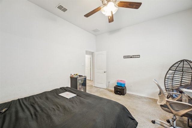 bedroom with ceiling fan and light carpet