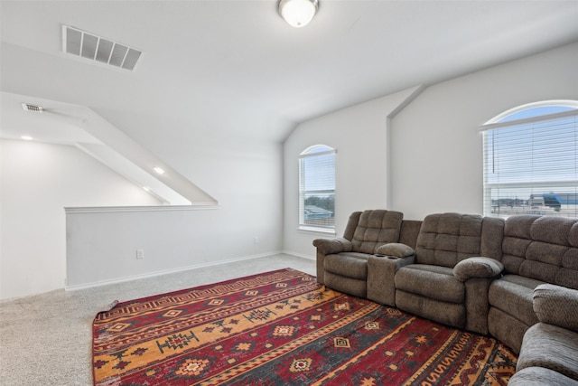 living room with lofted ceiling and carpet floors