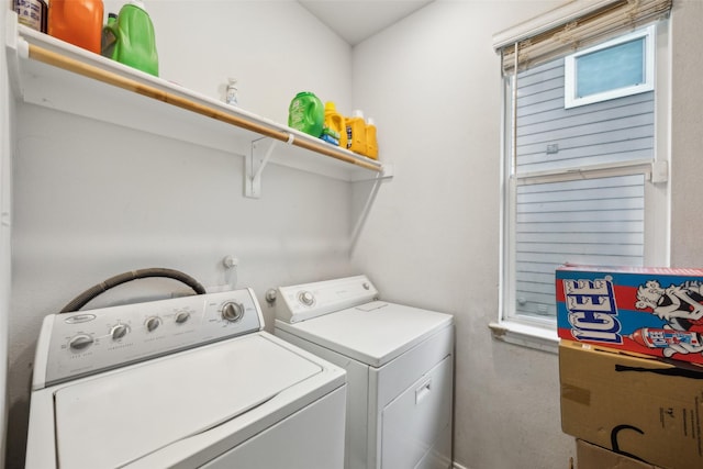 washroom featuring washer and clothes dryer