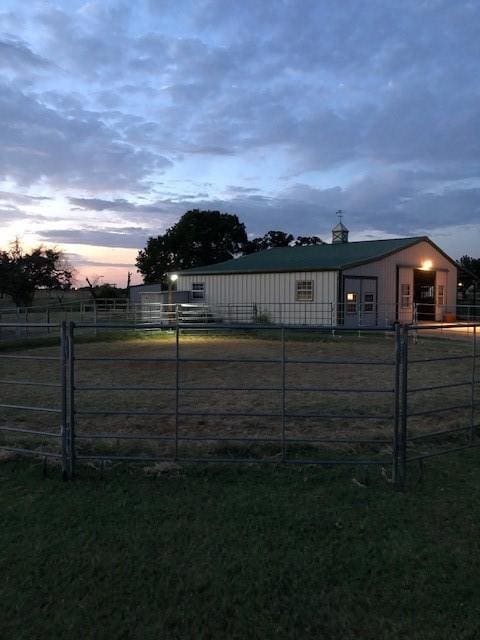 yard at dusk with an outbuilding