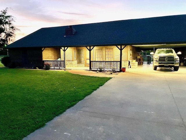 view of front facade featuring a porch and a lawn