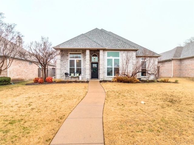 view of front of property with a front lawn