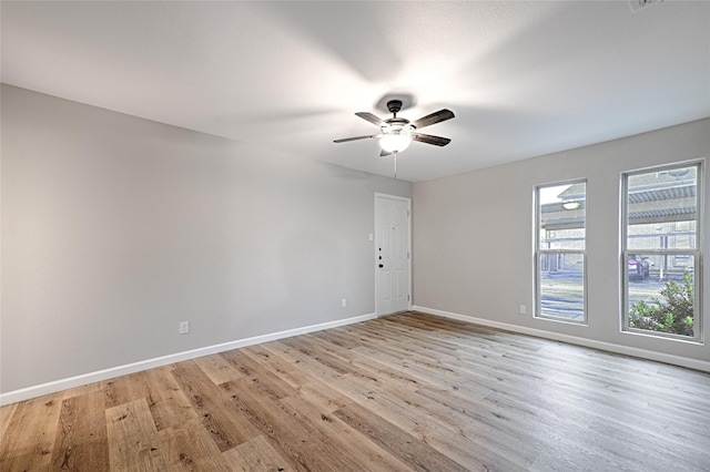 unfurnished room with ceiling fan and light hardwood / wood-style floors