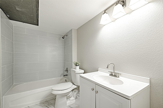 full bathroom featuring vanity, tiled shower / bath combo, and toilet