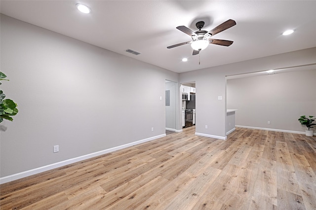 interior space with ceiling fan and light hardwood / wood-style flooring