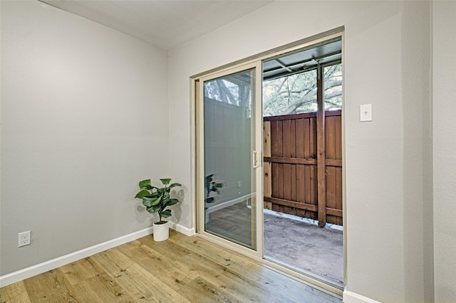 doorway to outside with hardwood / wood-style floors