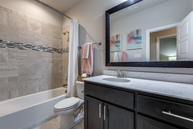 full bathroom with tile patterned flooring, vanity, shower / tub combo with curtain, and toilet