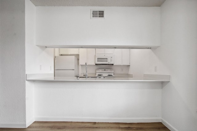 laundry area with washer / clothes dryer, laundry area, baseboards, and light wood finished floors