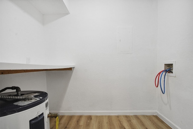 spare room with light wood-style floors, a textured ceiling, ceiling fan, and baseboards