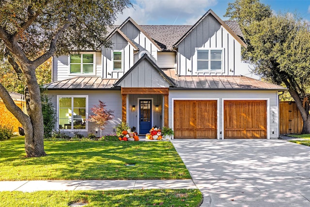 view of front of home featuring a garage and a front yard