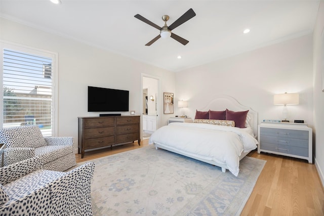 bedroom featuring crown molding, ceiling fan, and light hardwood / wood-style floors