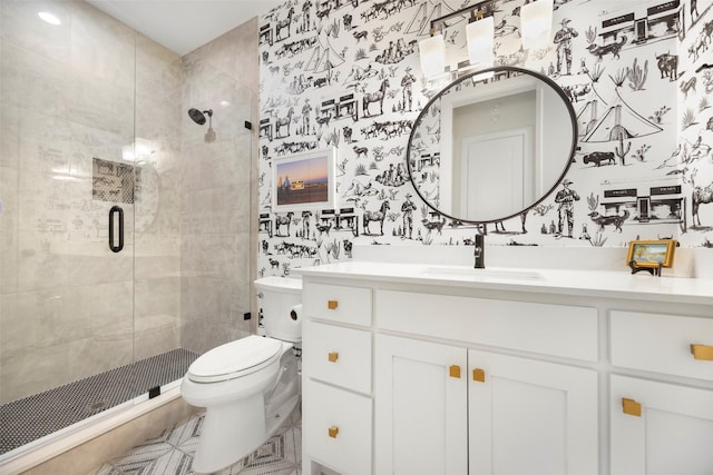 bathroom with a shower with door, vanity, and toilet