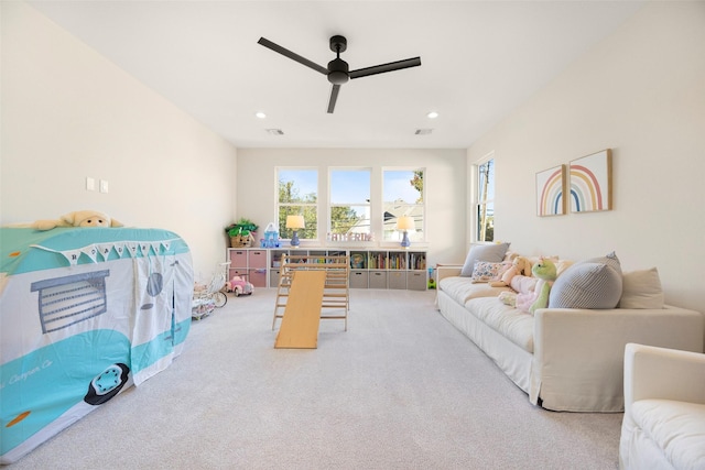 living room with ceiling fan and light carpet