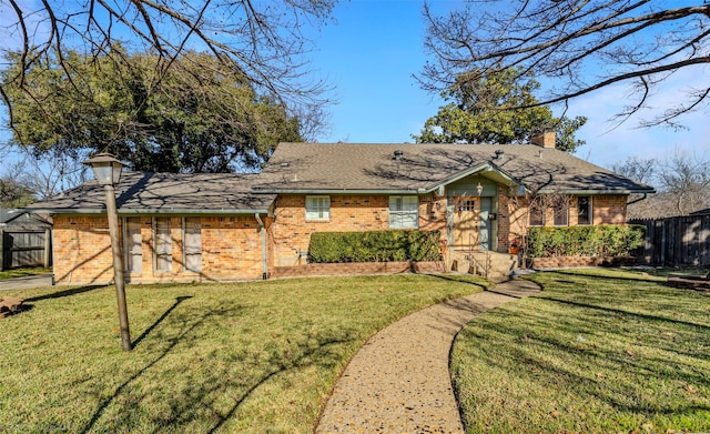 single story home with a front yard