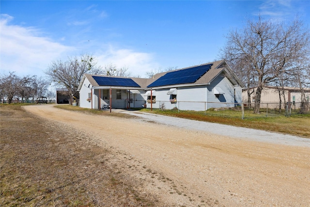 view of front of house featuring solar panels