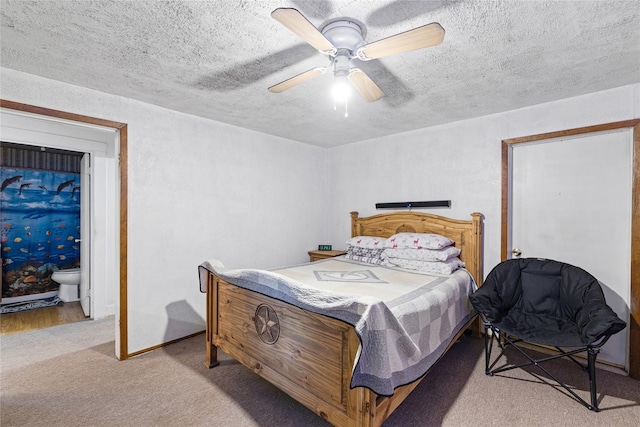 bedroom featuring light carpet, ceiling fan, and a textured ceiling