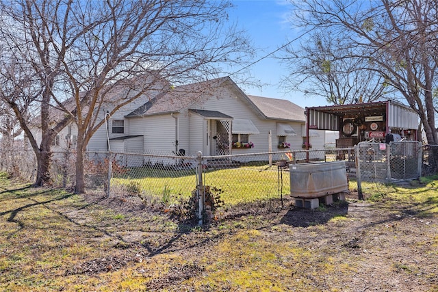 rear view of property featuring a yard