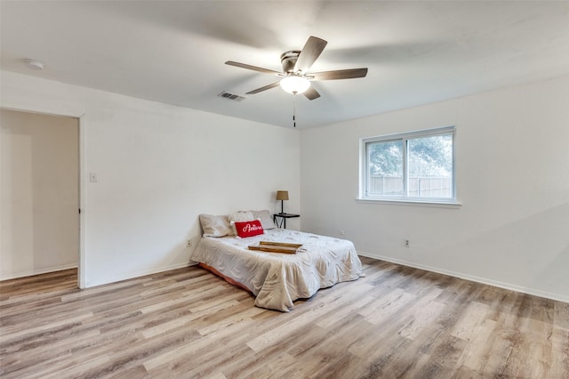 bedroom featuring ceiling fan and light wood-type flooring