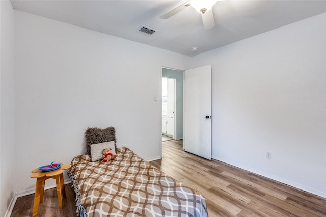 bedroom featuring ceiling fan and light hardwood / wood-style flooring