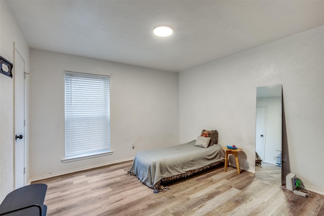 bedroom with light wood-type flooring