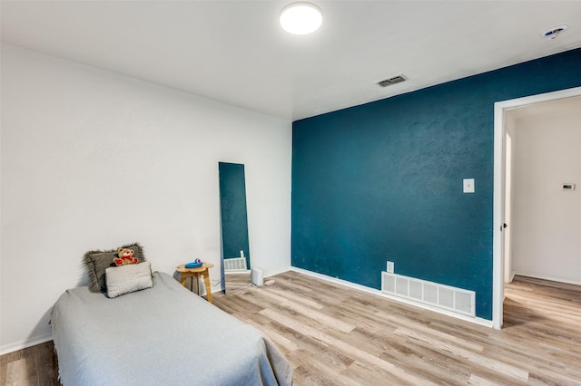 bedroom with wood-type flooring