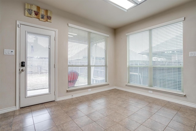 doorway featuring light tile patterned flooring