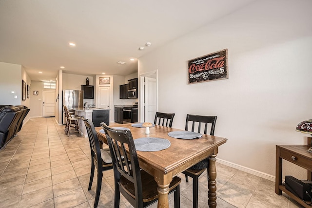 dining space with light tile patterned floors