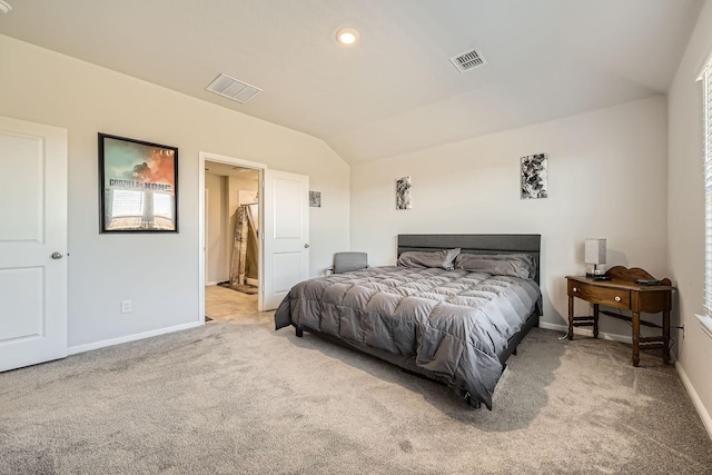 carpeted bedroom featuring lofted ceiling