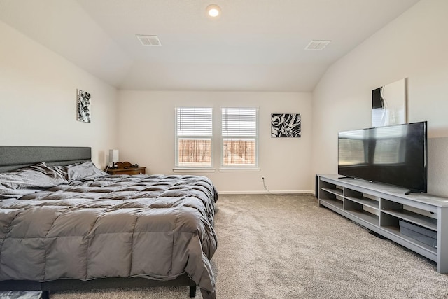 carpeted bedroom with vaulted ceiling