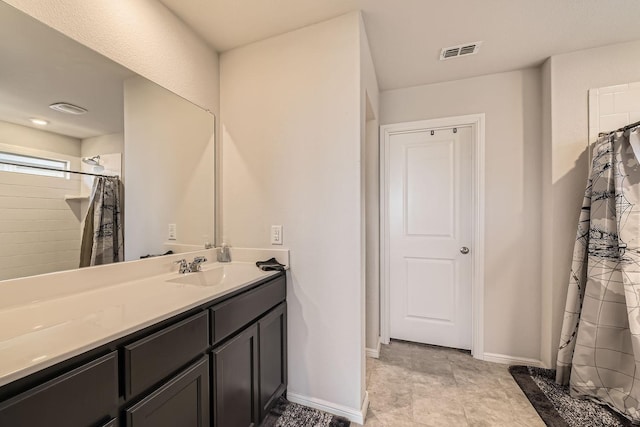 bathroom featuring vanity and a shower with shower curtain