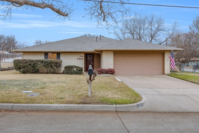 single story home featuring a garage and a front yard