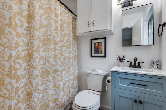 bathroom with walk in shower, vanity, and toilet