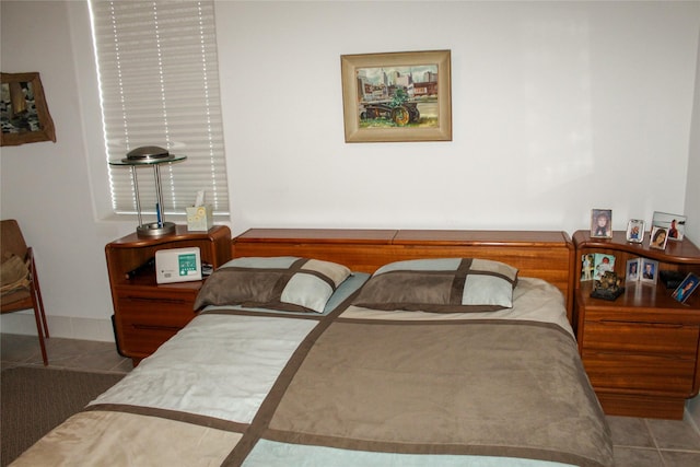 bedroom with tile patterned floors