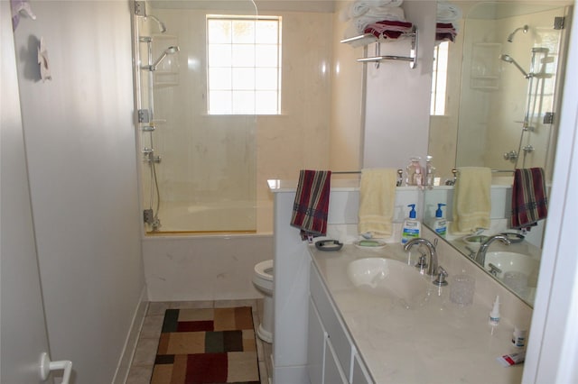 full bathroom featuring vanity, toilet, and tiled shower / bath combo