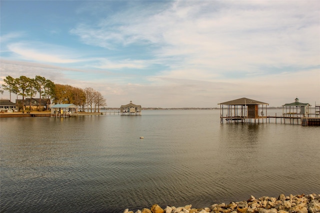 property view of water with a dock