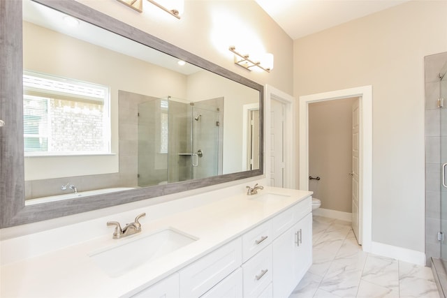 bathroom with vanity, toilet, and walk in shower