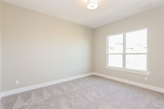 unfurnished room featuring carpet