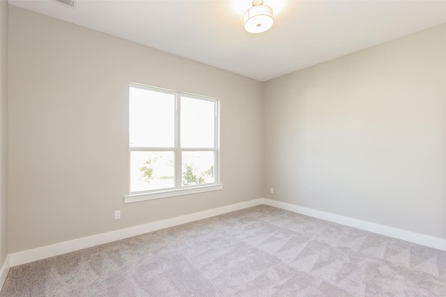 empty room featuring light colored carpet