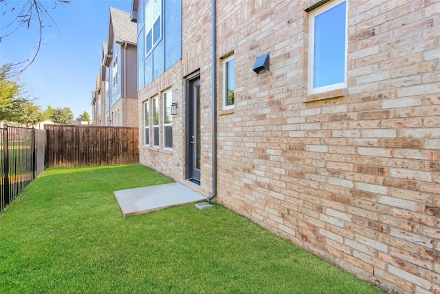 view of home's exterior with a yard