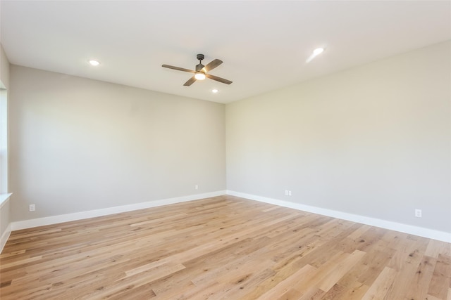 empty room with light hardwood / wood-style floors and ceiling fan