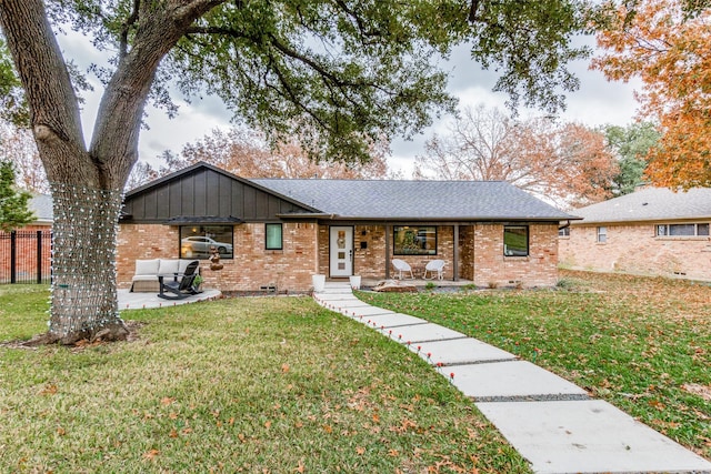 single story home with a patio area, a front yard, and outdoor lounge area