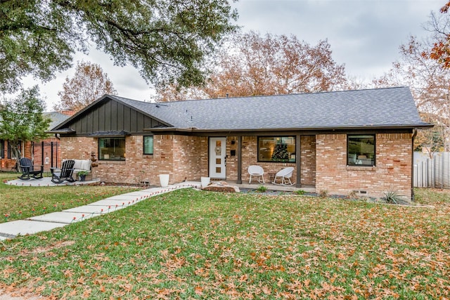 single story home featuring a front yard and a patio area