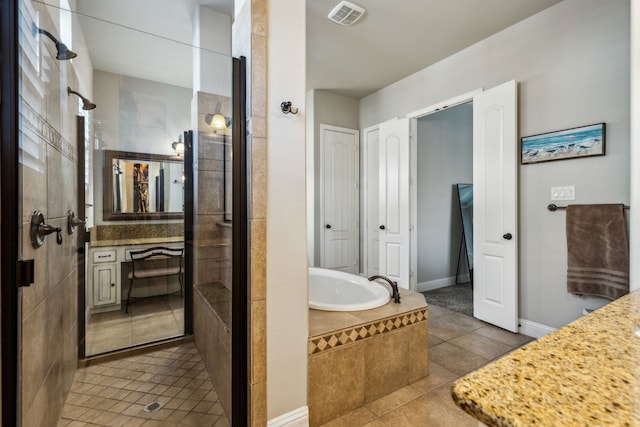 bathroom with tile patterned floors, vanity, and independent shower and bath