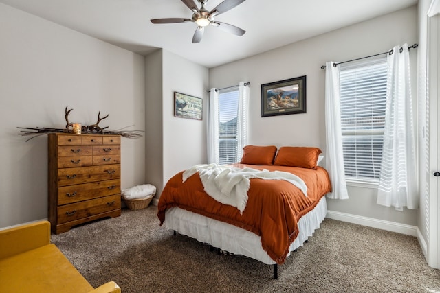 bedroom featuring ceiling fan and carpet