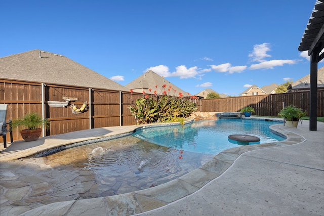 view of swimming pool featuring an in ground hot tub and a patio area