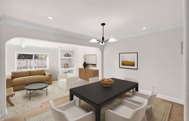 sitting room featuring crown molding, vaulted ceiling with beams, and dark hardwood / wood-style flooring