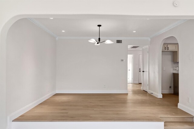 kitchen with sink, crown molding, appliances with stainless steel finishes, backsplash, and kitchen peninsula