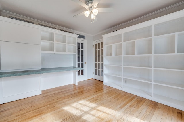 interior space featuring hardwood / wood-style floors, crown molding, and ceiling fan