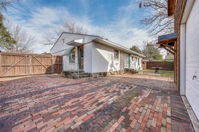 view of side of home featuring a patio