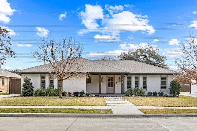 single story home featuring a front yard